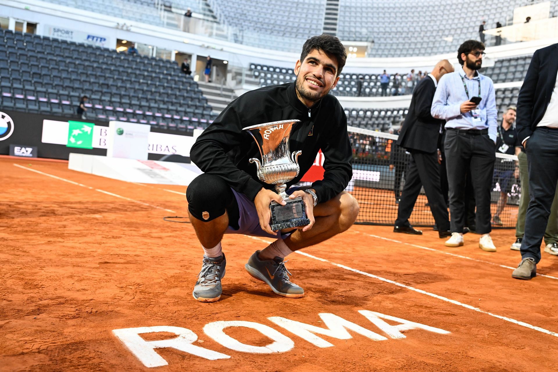 Carlos Alcaraz poses with the champion's trophy after defeating Italy's Jannik Sinner in the Italian Open final. Source: Getty
